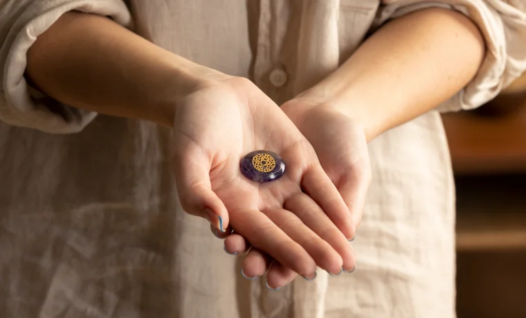 Person holding healing crystal for Reiki energy healing